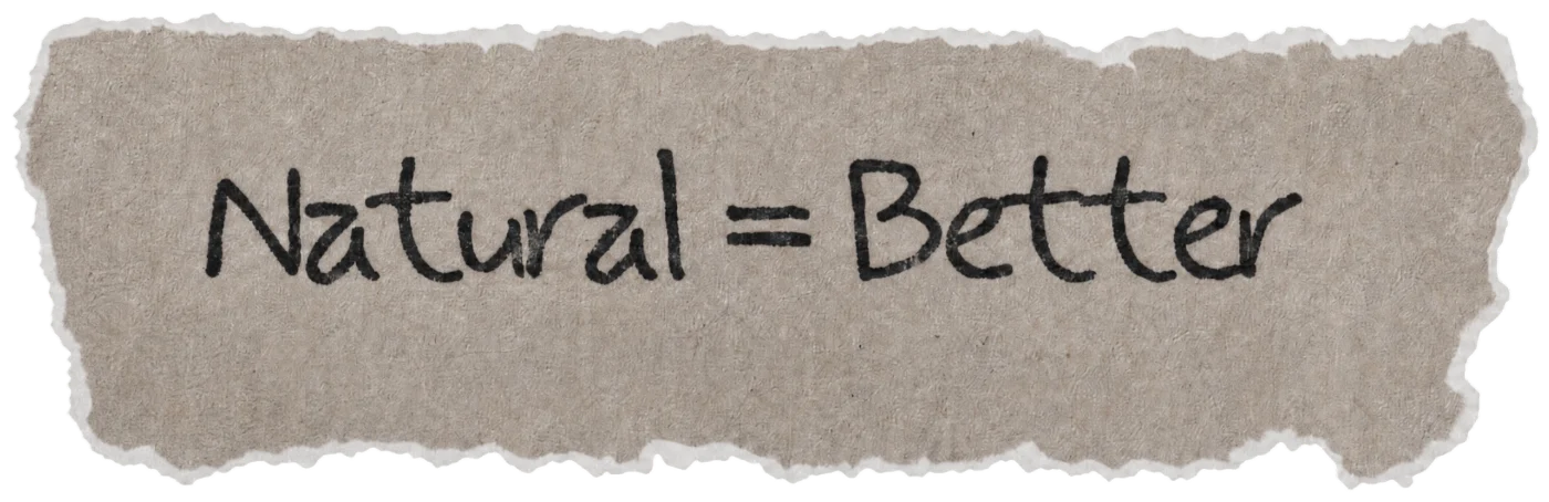 Torn paper note with the handwritten hair myth: Natural = Better