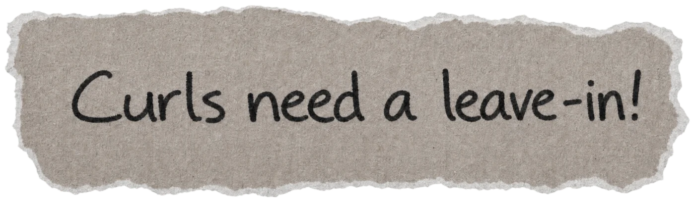 Torn paper note with the handwritten hair myth: Curls need a leave-in!